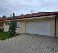 A family house on Lotosova Street in Malinovo with a garden and a large garage.