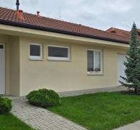 A family house on Lotosová Street in Malinovo with a white facade and a garden.