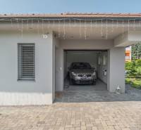 A family house on Janka Matúšku in Bánovce nad Bebravou with a garage and a car.