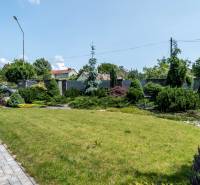 The garden at the family house on Janka Matúška Street in Bánovce nad Bebravou with a manicured lawn.