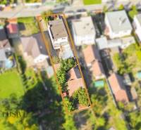 Aerial view of a family house in Veľká Mača with surroundings and greenery.