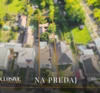 Aerial view of a family house in Veľká Mača, surrounded by greenery and gardens.