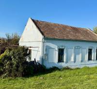 A family house in Štefanová with classic architecture and a garden surrounded by greenery.