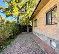 Family house on Prostredná Street in Svätý Jur with a sidewalk and greenery.