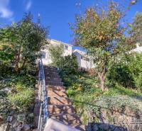 The staircase to the family house on the street in Bratislava - Devín surrounded by greenery.