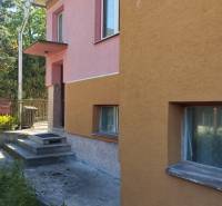 A family house in Divinka on Lalinok Street with a colorful facade and concrete stairs.