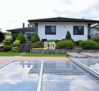 Villa in Súľov-Hradná with a pool, terrace, and landscaped garden.