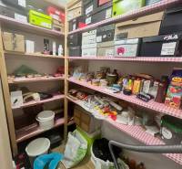 Storage space with lots of boxes and household items in a 3-room apartment.