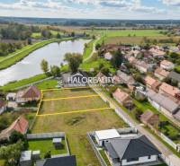 Land - housing in Brodské by the river, surrounded by houses and nature.