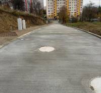 A new road in Liptovský Mikuláš, Podbreziny Háje, leads to apartment buildings. Land - residential.