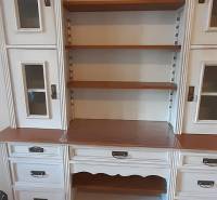 White display cabinet furniture with shelves and decorative handles in a 4-room apartment.