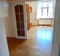 Interior of a 4-room apartment with a wooden decor floor and a wooden bunk bed.