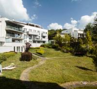 Residential complex with a garden on Eleventh Street, Bratislava - Nové Mesto, offers a children's playground.