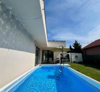 A family house in Trnava with a garden pool, terrace, and veranda.