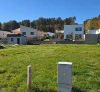 Plots - living in Kováčová, with a view of modern houses and a green environment.