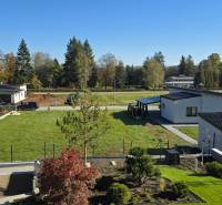 Kováčová offers residential plots with modern houses surrounded by greenery and trees.