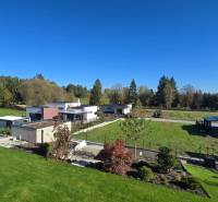 Lands - housing, Kováčová: Gardens, lawns, and houses in a peaceful rural environment.