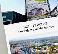 Building with a real estate agency advertisement on Štefánikova Street 10, Michalovce.
