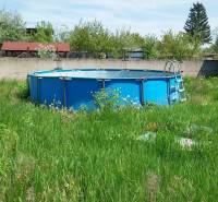 In the picture, there is a garden with a swimming pool, near a family house on Štúrova Street.