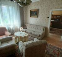 Living room on Štúrova Street with armchairs and a decorative table in a family house.