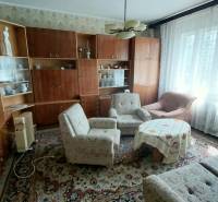 Living room on Štúrova Street, family house, sofa, wall unit, carpet, and armchairs.