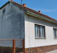 A family house on Štúrova Street, with a gable roof and a brick fence.