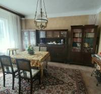 Living room with furniture on Štúrova Street in a family house, radiators, carpet, wallpaper.