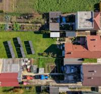 A top view of a family house with photovoltaic panels in the garden on Južná Street, Veľké Orvište.