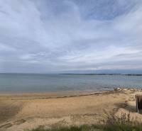The beach and sea at the city coast in the resort of Nin.