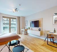 1-bedroom apartment with a bed, dining table, and TV, floor with wooden decor.