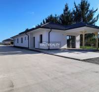 A family house in Blahová with a light facade and a wide adjacent concrete walkway.