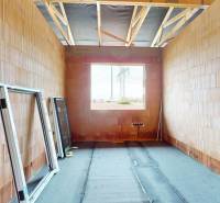 Construction of a family house in Bernolákovo with windows ready for installation.