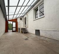 Family house on Jilemnického in Dvory nad Žitavou. Covered entrance area with a concrete floor.