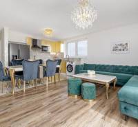 Living room in a family house with a wooden decor floor and luxurious furnishings.