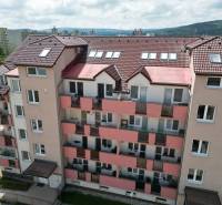 Apartment building in Pezinok on Dona Sandtner Street with a view of the surrounding countryside.