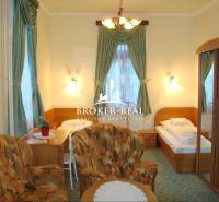 Room with a bed, chairs, and a mirrored wardrobe, category - Hotels and guesthouses.