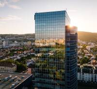 Panorama of Bratislava with the reflection of the city on a glass building, view from Vajnorská Street.