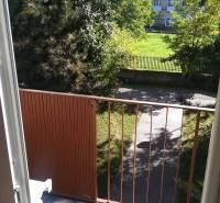A balcony with a view of greenery and the sidewalk on Horná Street in Bratislava - Krasňany.
