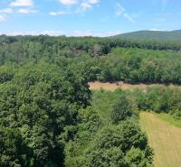 Forests and meadows around Čaradice, suitable for commercial land.