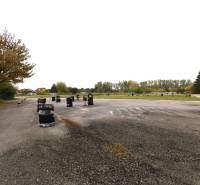 Commercial land on Nebojsa Street in Galanta, with an asphalt surface and tires.