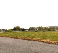 Commercial plots on Nebojsa Street in Galanta, visible road and green spaces.