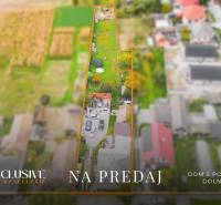Aerial view of a family house in Dolné Saliby with a large plot of land for sale.