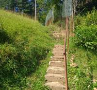 Stairs leading uphill surrounded by greenery in the Recreational Grounds in Žilina.