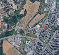 Aerial view of Jurkovičova Street in Prešov with surrounding buildings and greenery.