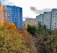A view of apartment buildings and autumn trees in Bratislava on Ján Smrek Street.