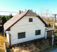 A family house on Na kopci Street in Žilina with a white facade and a sloped roof.