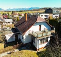 A family house on Na kopci Street in Žilina with a view of the mountainous landscape.