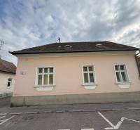 A family house on Hviezdoslavova Street in Piešťany with a pink facade and a hipped roof.