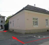 A family house on Hviezdoslavova Street in Piešťany with a pink facade and a sloped roof.