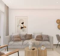 A bright living room in a holiday apartment with a gray sofa and a wooden coffee table.